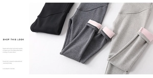 Lined maternity leggings in black and grey with warm pink fleece interior detail