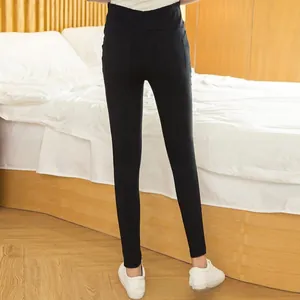 Rear view of black high-waisted maternity leggings with double back pockets