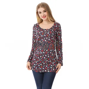 Close-up of nursing top showing the small floral pattern on soft navy elastic fabric