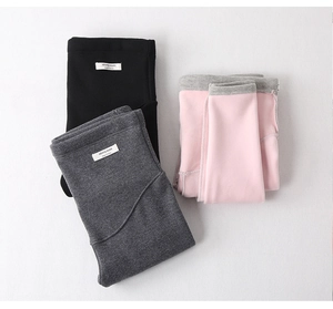 Close-up of maternity leggings with warm fleece lining in black, grey and pink colors