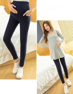 Detail of high waist maternity leggings in navy blue with stretchy support band