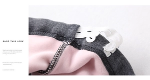 Detail view of adjustable waistband with pink fleece lining on maternity trousers
