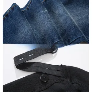 Close-up of adjustable waist elastic band and D-ring buckle on denim maternity pants