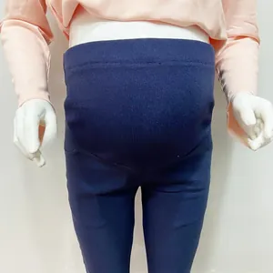 Detail of navy blue maternity leggings with high waist elastic belly support on mannequin