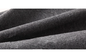 Close-up of thick dark grey fleece-lined fabric for maternity winter trousers