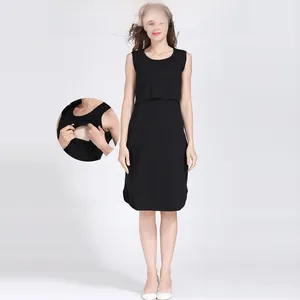 Detail of black maternity dress featuring a discreet double-layer nursing opening for breastfeeding