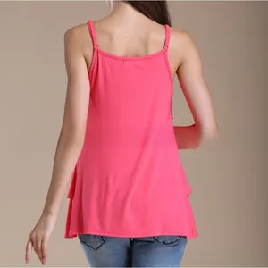 Detail of rose pink nursing tank top featuring thin straps and double-layered ruffle hem