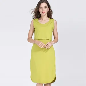 Detail of lime green sleeveless nursing dress with layered round neck design