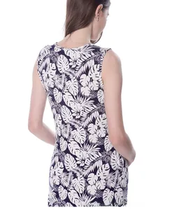 Close-up of maternity nursing dress featuring tropical leaf print and cotton fabric texture