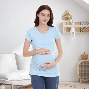 Close-up of light blue maternity V-neck T-shirt with side ruching for belly growth