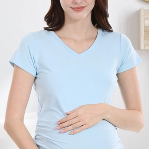 Detail of light blue V-neck maternity T-shirt with side ruching for belly comfort