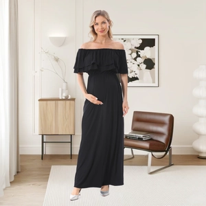 Dettaglio vestito lungo premaman nero a spalle scoperte con eleganti doppie balze