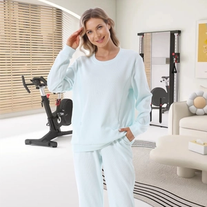 Relaxed fit light blue waffle knit lounge set for women shown in a modern home interior
