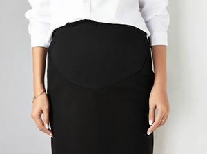 Detail of high-waist maternity skirt with adjustable elastic belly support band