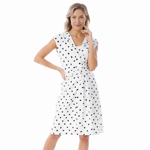 Detail of V-neck floral maternity dress with black heart pattern and waist tie detail