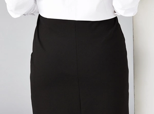Detail of maternity office pencil skirt with slim fit cut lines on a professional black fabric