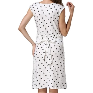 Back view of white floral maternity dress featuring a cat print and waist tie bow