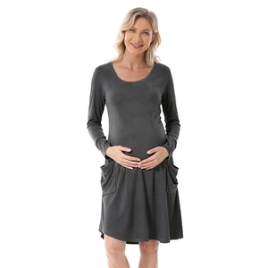 Long-sleeved dark grey maternity dress with round neck and side pockets in A-line cut