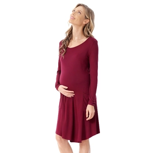 Detail of burgundy maternity dress showing long sleeves and side pocket functionality