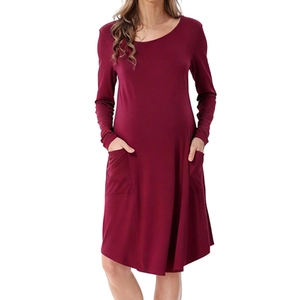 Detail of soft burgundy long sleeve maternity nursing dress with practical side pockets