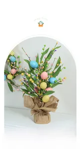 Easter egg artificial flower arrangement in a rustic burlap base for home table decor