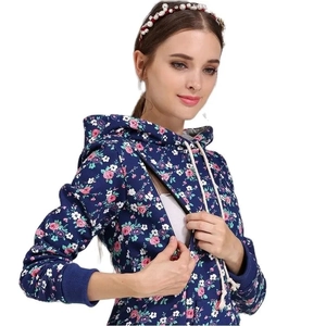 Detail view of floral maternity hoodie featuring side zipper for breastfeeding convenience