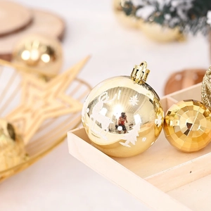 Golden Christmas ball set with reindeer and snowflake patterns and geometric baubles
