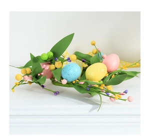 Detail of Easter egg wreath with colorful speckled eggs, berries, and yellow plaid ribbon