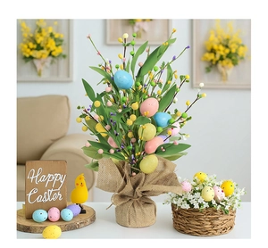 Easter table decor featuring colorful speckled eggs and green berries in burlap base
