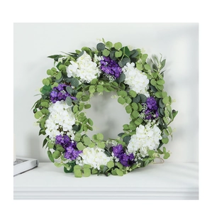 Detailed texture of artificial spring wreath with eucalyptus leaves and white hydrangeas