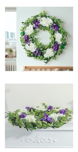 Detail view of artificial spring wreath with eucalyptus leaves and white hydrangea flowers