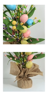 Detailed view of Easter eggs with berries and burlap base for spring home decor