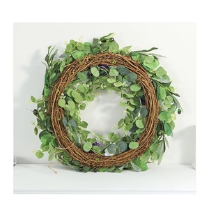 Close-up of artificial violet wreath with green eucalyptus leaves on natural vine base