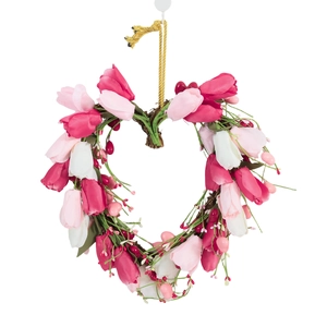 Heart-shaped tulip wreath with pink and white flowers on a natural rattan base
