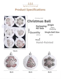 Detail view of 8cm hand-painted Christmas balls with gingerbread man and snowflake patterns