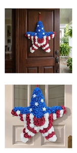 Star-shaped patriotic wreath decoration for Independence Day hung on dark and glass doors