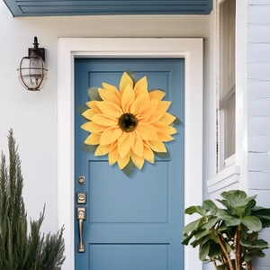 Fall sunflower wreath with yellow burlap petals on a blue door for home wall decoration