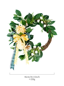Detail of 18 inch decorative wreath with faux dahlias and yellow daisy pattern ribbon