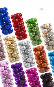 Detail of multi-colored 6cm Christmas balls with matte, glossy, and glitter finishes