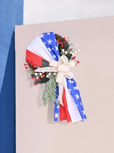 Detail of July 4th patriotic wreath with red white blue stars and burlap bow decoration
