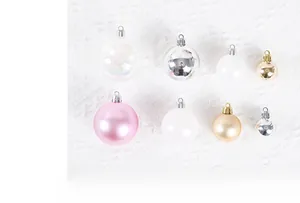 Detail of multi-size 3-10cm Christmas ball ornaments in mixed metallic and pearl finishes