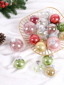 Detail of glitter Christmas balls and transparent ornaments in a golden metal basket