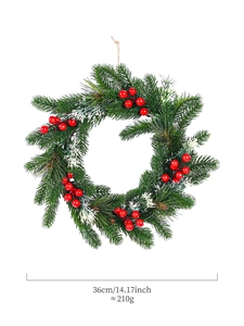 Detail of 36cm Christmas wreath showing artificial pine needles and red berries
