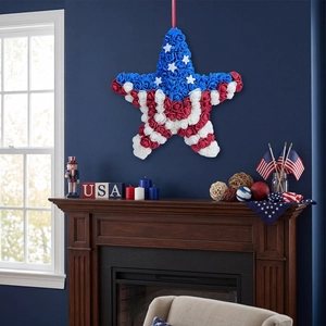 Star-shaped USA Independence Day wreath with red, white and blue foam roses for door decor