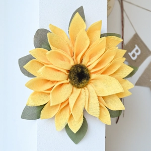 Detail of yellow and green burlap mesh sunflower wreath with natural fiber texture