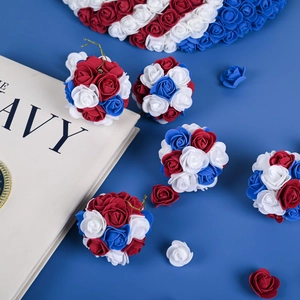 Macro view of red, white and blue foam rose flower balls for Independence Day decor