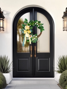 Artistic front door wreath with yellow dahlias, green foliage and a plaid ribbon bow