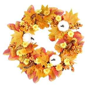 Autumn wreath with maple leaves white pumpkins berries and daisies for home wall decor