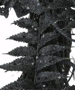Close-up of black glitter artificial fern branches for Halloween festive decoration