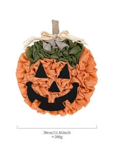 Detail of 30cm handmade burlap pumpkin wreath with black felt face and jute bow